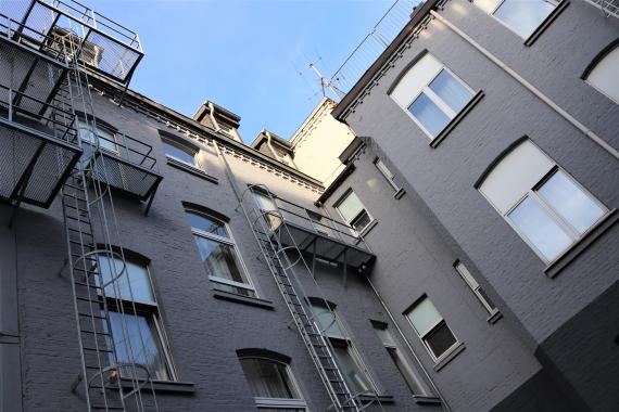 Photo of residential houses from the frog perspective.