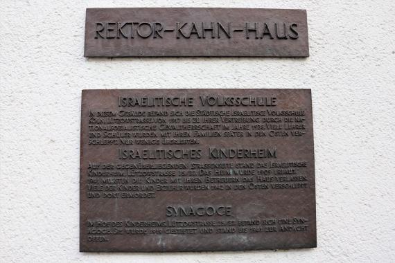 Old metal plate with inscription.