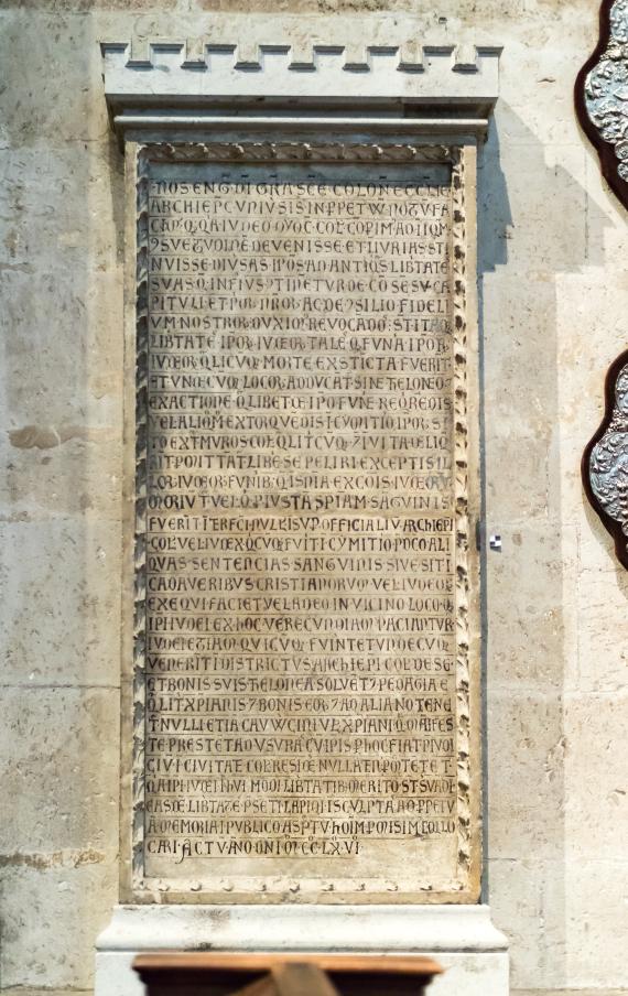 Large old stone tablet with inscription.