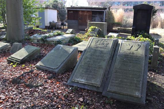 Several tombstones placed next to each other.