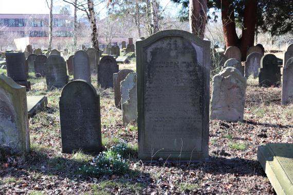 Several tombstones placed next to each other.