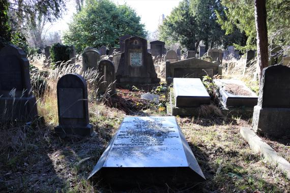 Large tombstone on the ground.