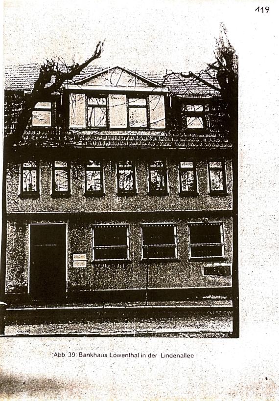 Black and white photograph of a three-storey building