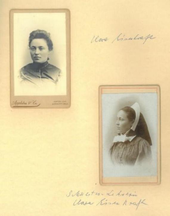 On display are two portrait photographs of Clara Eisenkraft. Next to the upper picture is the handwritten note "Clara Eisenkraft" and next to the lower picture is "Sister-Teacher Clara Eisenkraft".