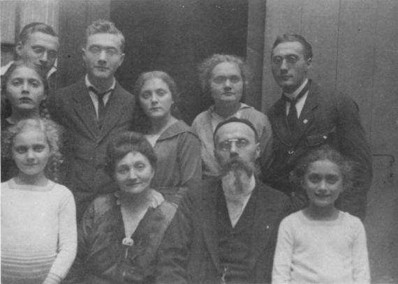 Family photo with eight children, mostly adults