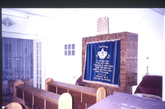 Photo of the Torah shrine and benches for sitting