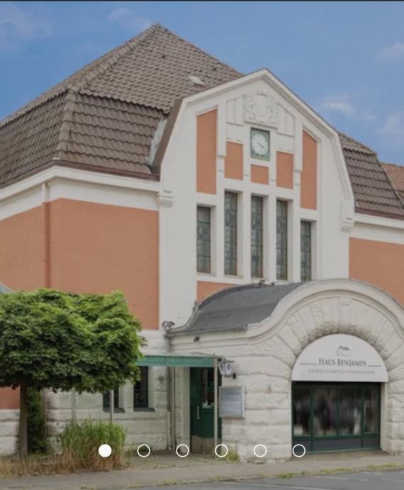 former station building painted in pink and white