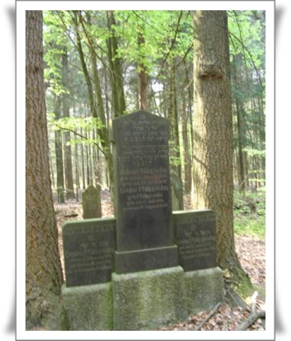 A large tombstone with base and inset headstone.