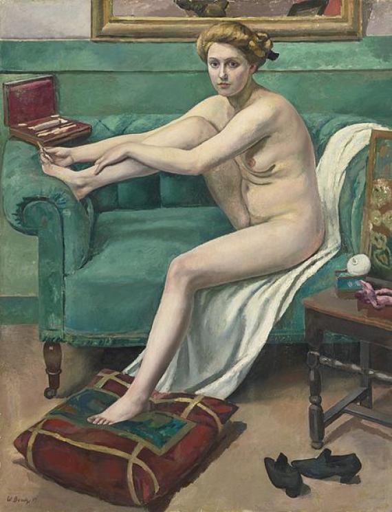 Nude woman on sofa