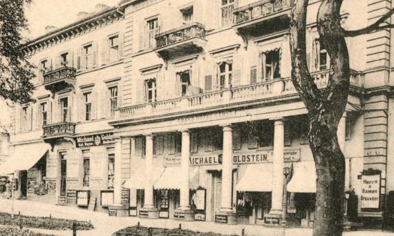 Historical picture postcard Bad Kissingen - Grand Hotel Garni with King Max monument - mailed on September 2, 1906 - detail enlargement - fashion store Michael Goldstein, Kgl. bayer. Purveyor to the court