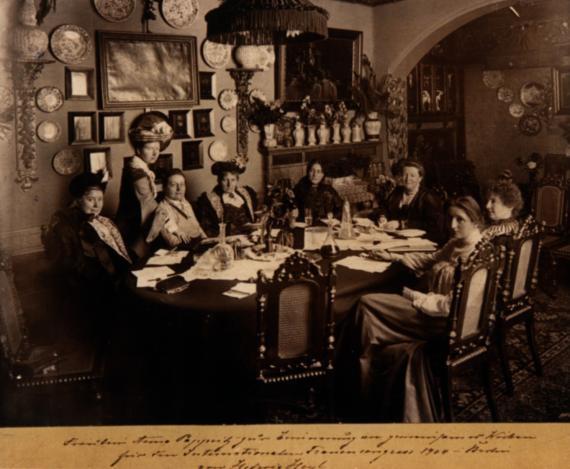 Women sit together at a round table