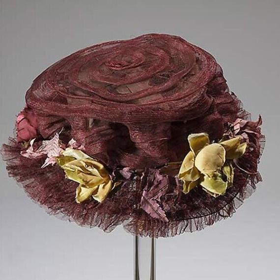 Horsehair hat with fabric flowers over a wire frame