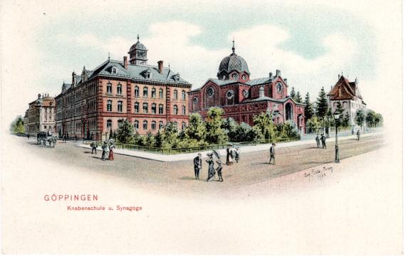 Göppingen - Knabenschule und Synagoge Smartly dressed people stroll in the foreground, two large buildings can be seen in the background.