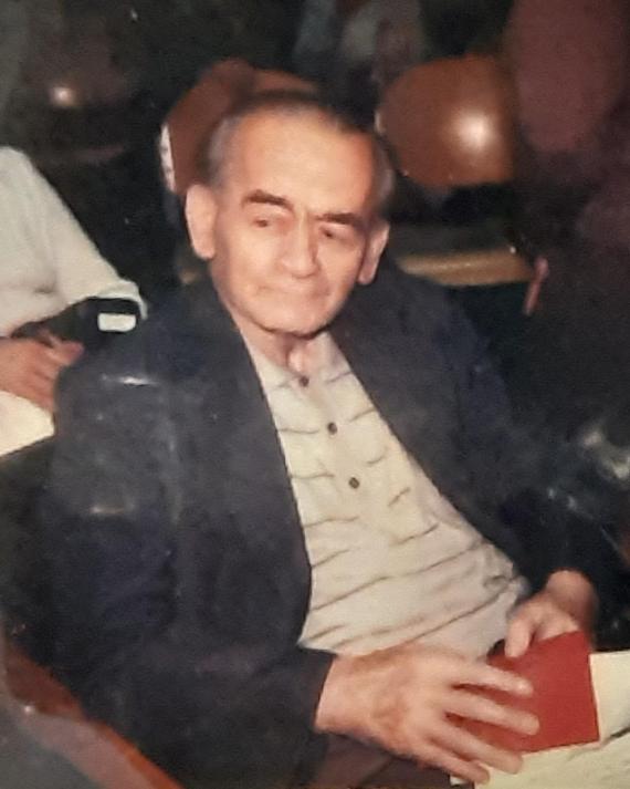 Elderly man sitting comfortably on a chair