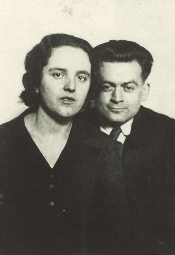 Portrait photo of a couple, both looking towards the camera