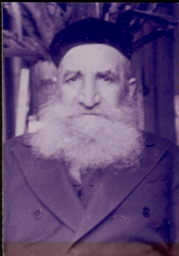 Older man with beard looking directly into the camera