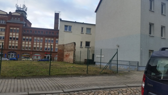 Building gap with fence adjacent to a building