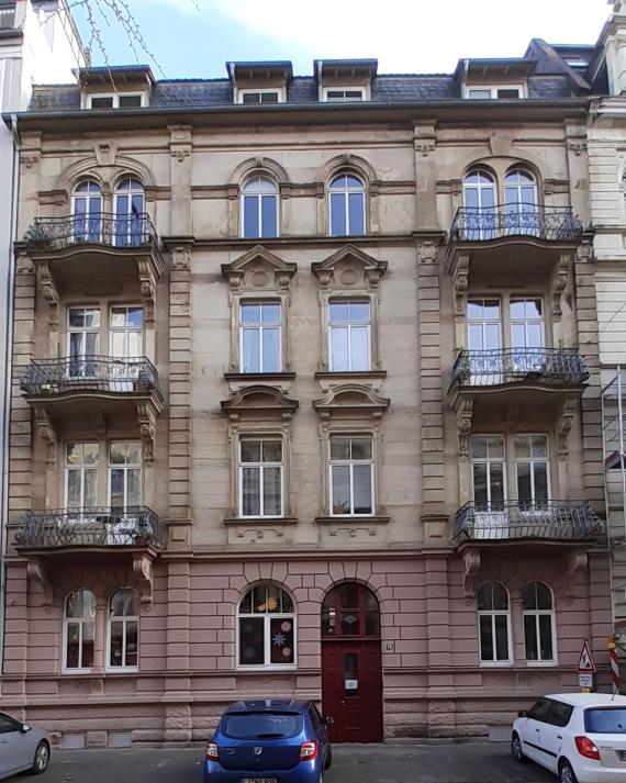 Multi-storey old building with many balconies