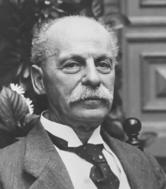 Black and white photograph of an elderly man in a bust portrait