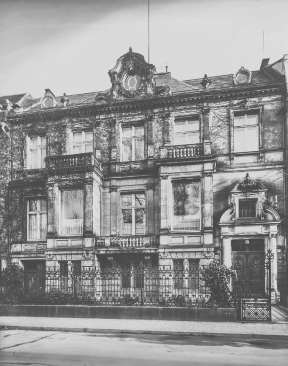 Black and white photograph of a three-story, representative house view