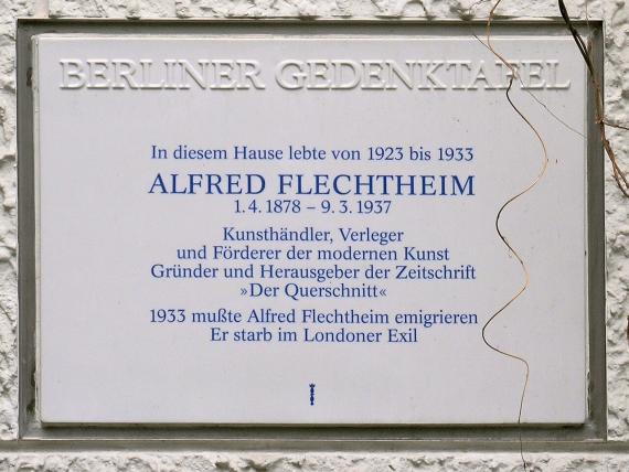 White plaque with blue lettering