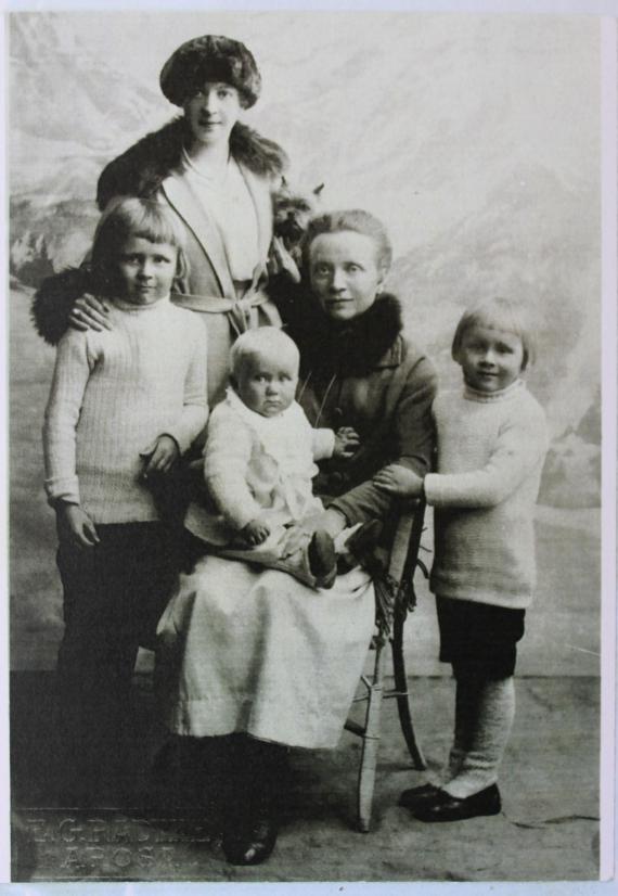 Black and white photograph of several people looking into the camera