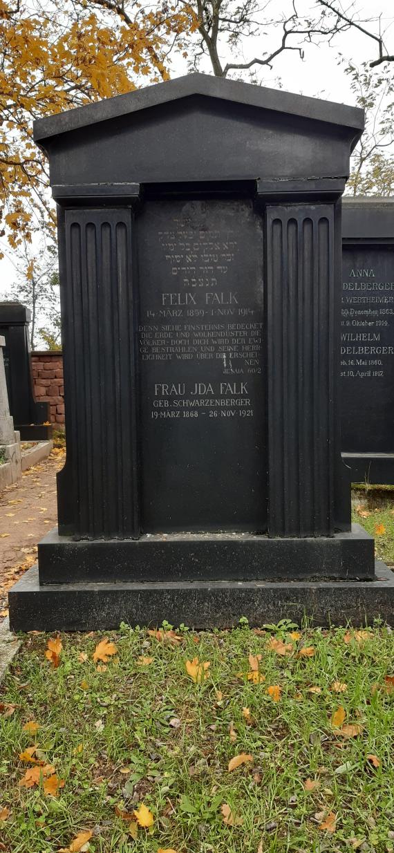 Color photo of an imposing gravestone in black with indicated columns