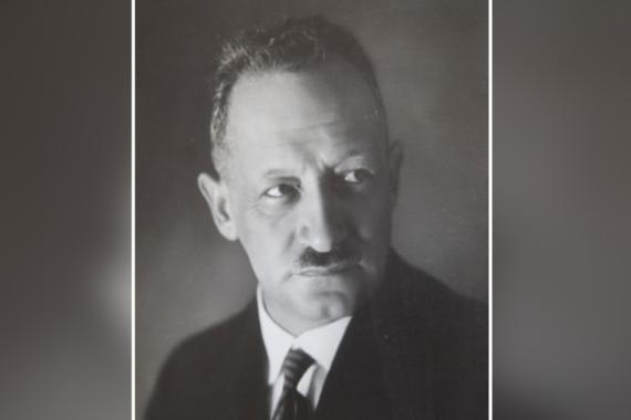 Black and white photograph of an elderly man in three-quarter profile