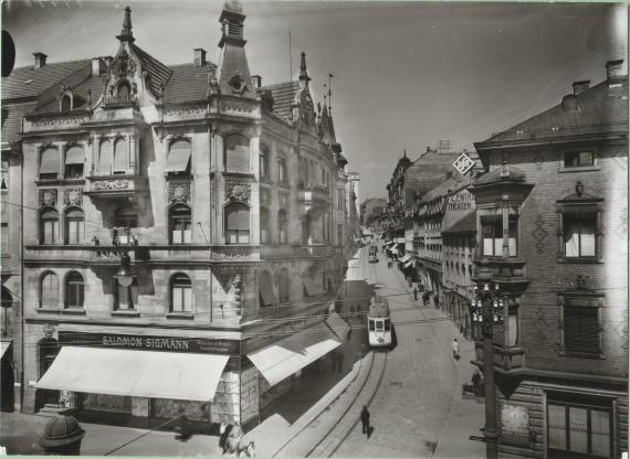 Historical black and white photograph of a street from a slightly elevated position