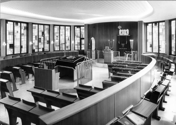 The interior of the synagogue can be seen looking east towards the Torah shrine