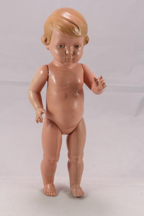 Old play doll without clothes