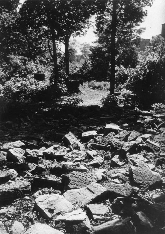 Pictured are smashed gravestones