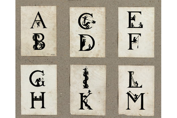 The picture shows six playing cards, each with two decorated capital letters