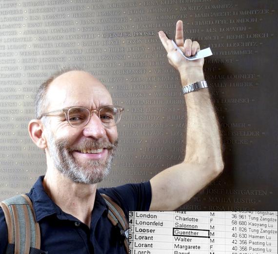 Tom Looser finds his Father's name on the 'Wall of Names'