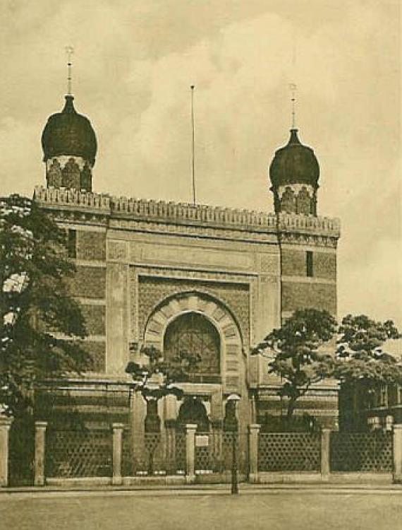 View of the square building of the synagogue with two towers and spherical domes