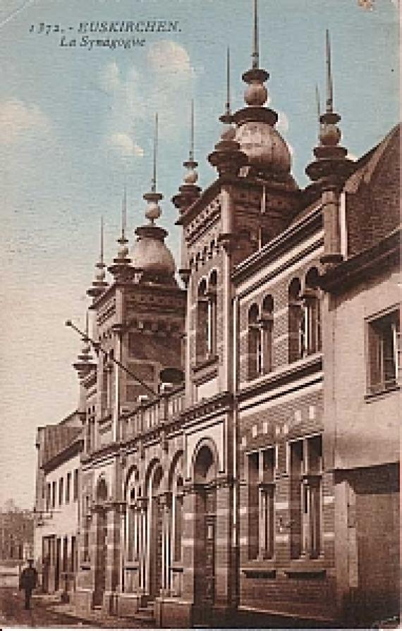 Side view of the tall building of the synagogue with many turrets and domes