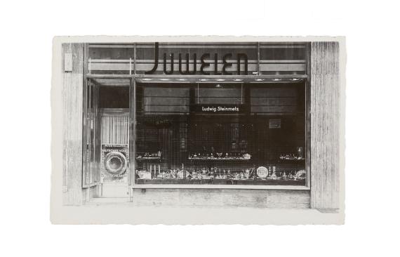 Black and white picture of jewelry store, shop window with showcase