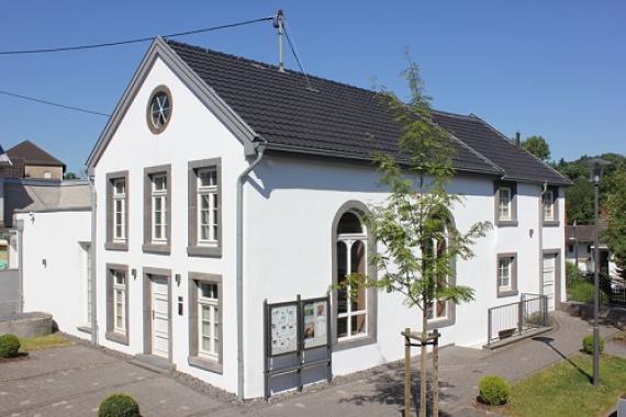 White house with dark pitched roof