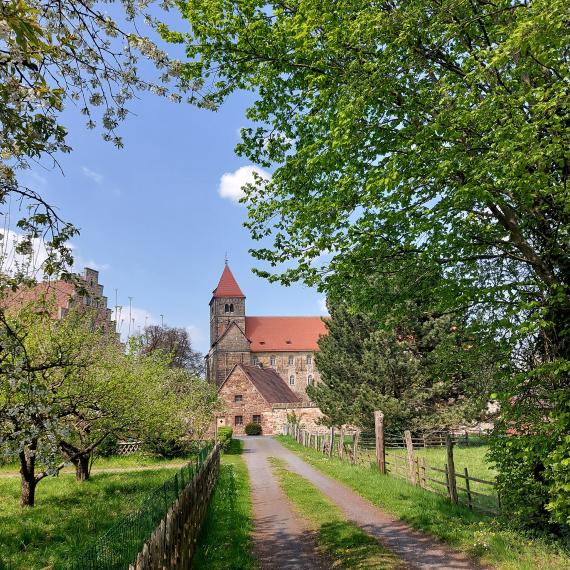 Parts of the monastery grounds in Breitenau, with the church in the center and the Breitenau concentration camp memorial on the left.