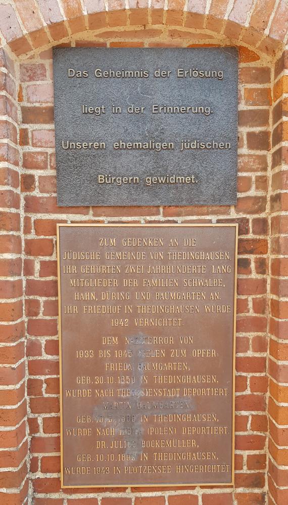Memorial plaque on the pigeon tower in the town hall square.